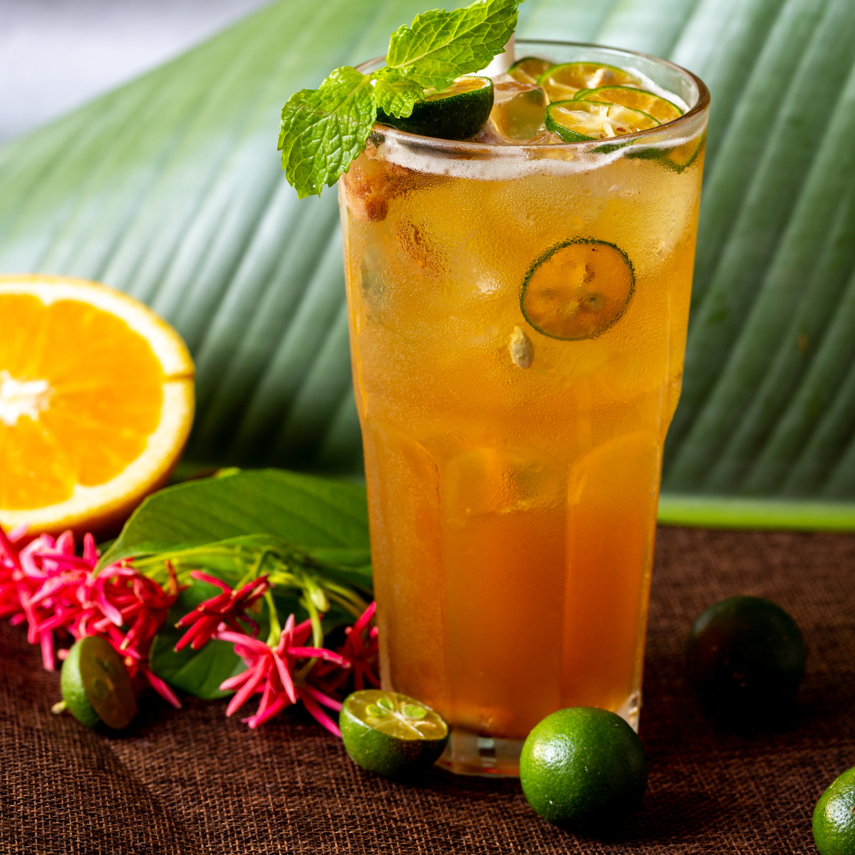 Premium kumquat lemon tea and fruit beverage prepared with citrus syrup featuring vibrant flavor and refreshing sweetness
