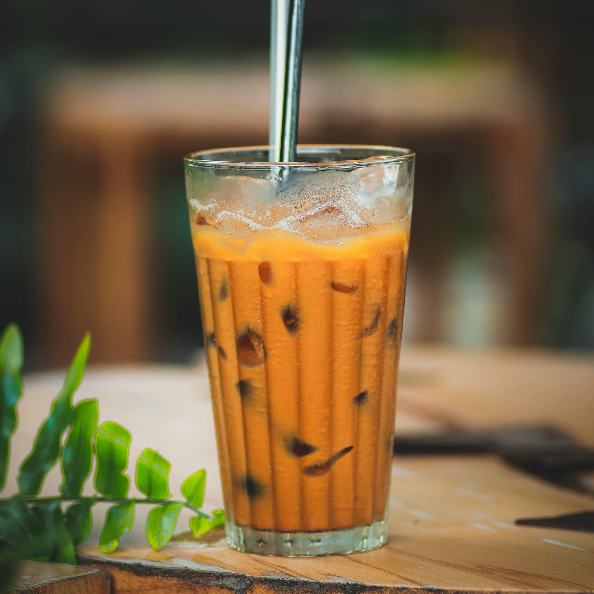 Hot pumpkin milk tea made with pumpkin powder featuring rich seasonal flavor and smooth texture