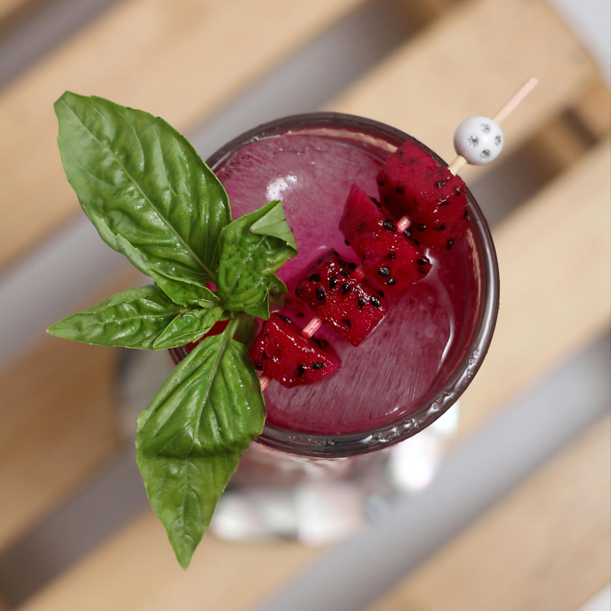 dragon fruit cocktail drink with fresh fruit garnish