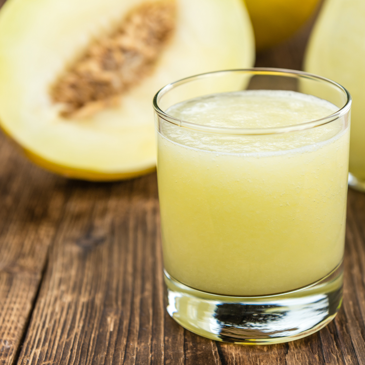 honeydew melon drink made from honeydew powder with fresh melon background
