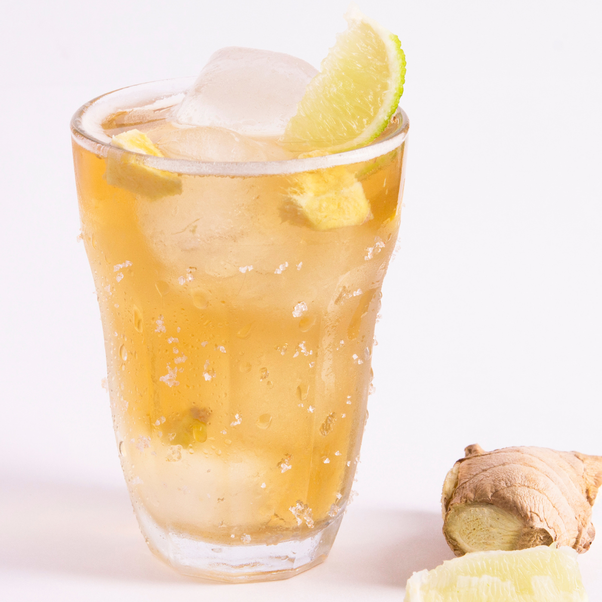 iced ginger drink with lemon and ice cubes for summer refreshment