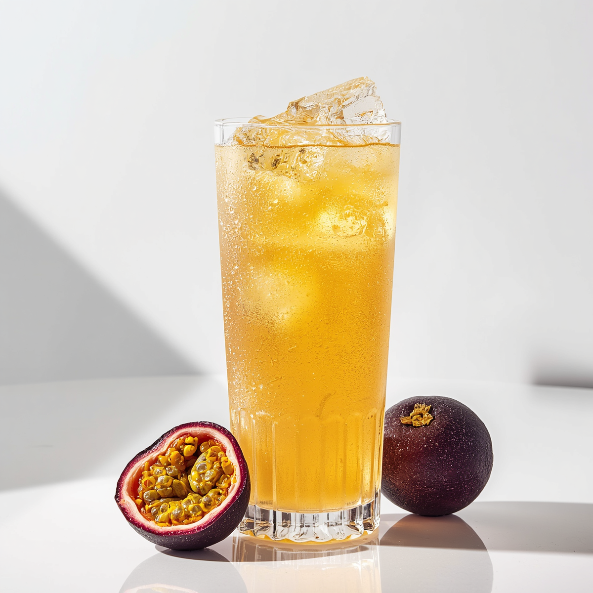 Passion fruit iced beverage made with passion fruit syrup featuring bright tropical sweetness and tangy fruit flavor