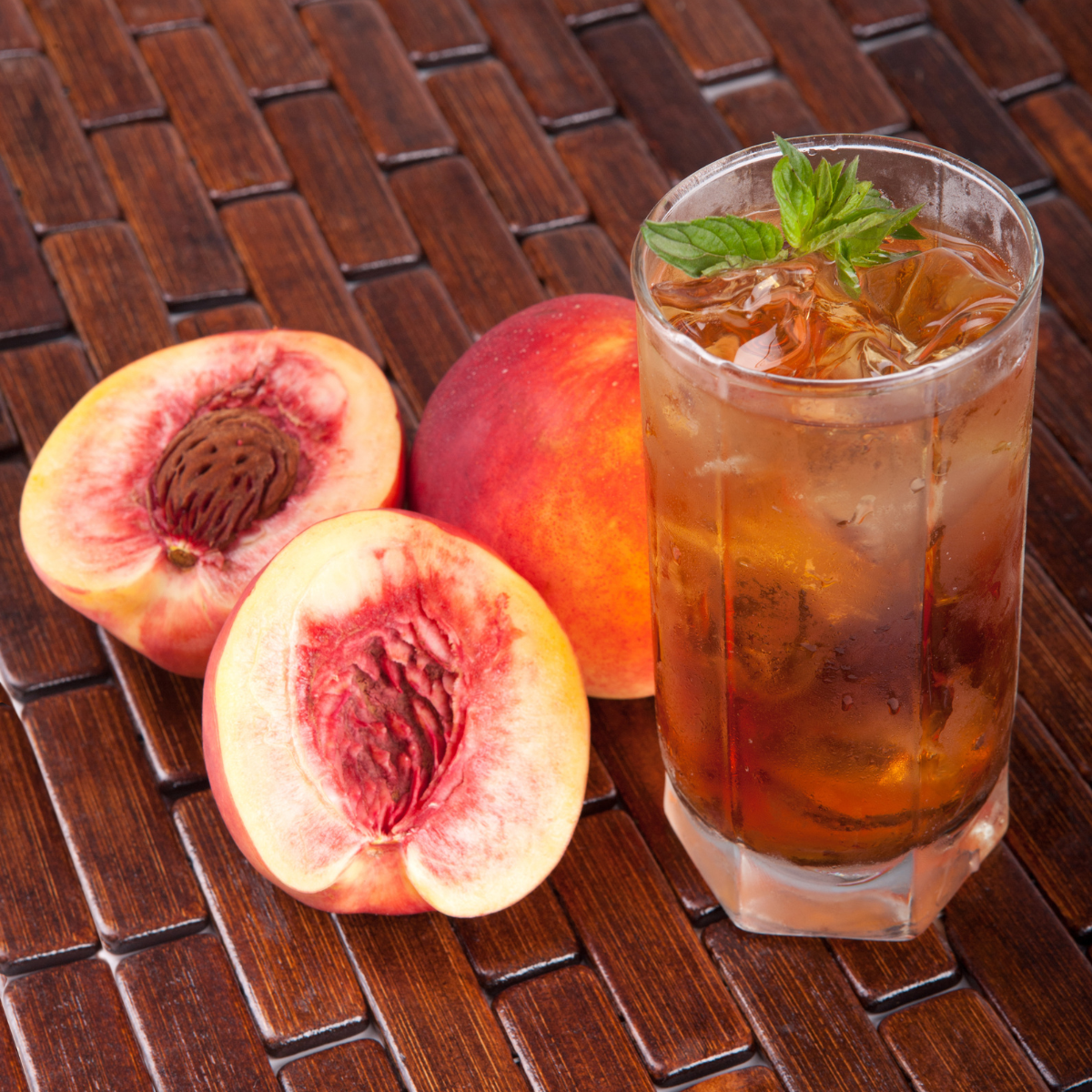 Peach iced tea made with pink peach syrup featuring fresh peach aroma and refreshing fruit tea flavor