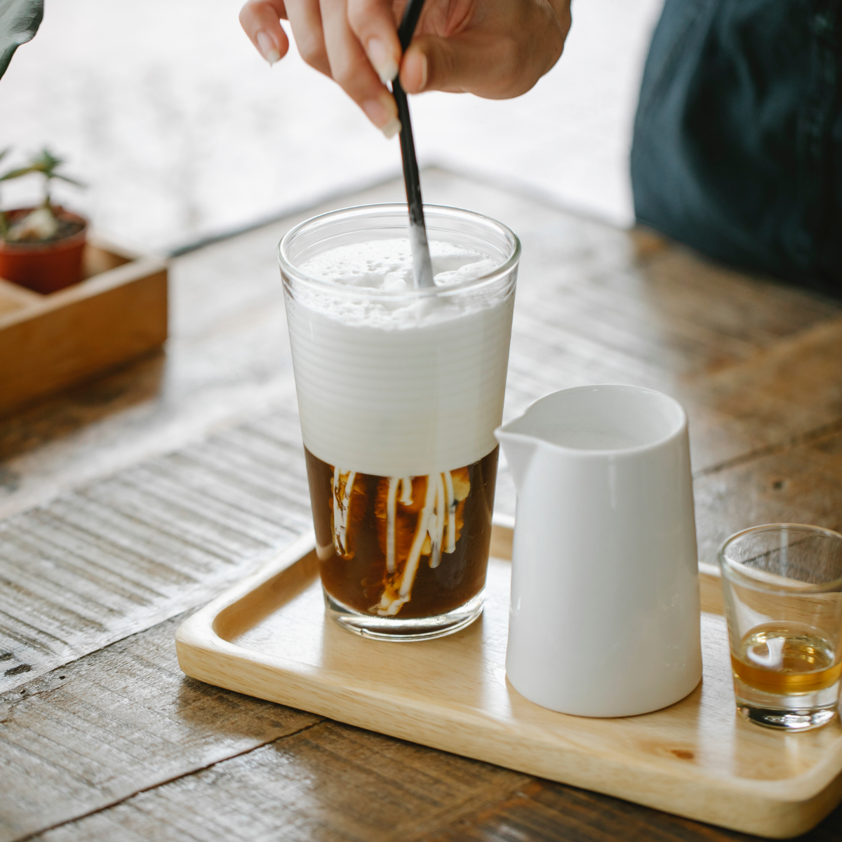 Mixing creamy salted foam for bubble tea coffee and layered café drinks