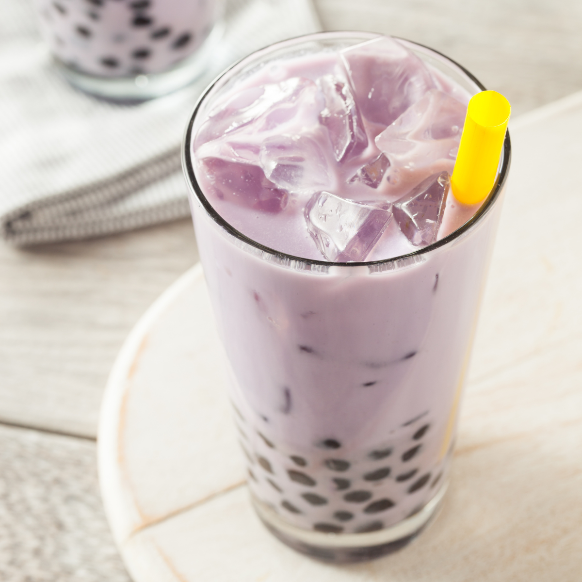iced taro milk tea with tapioca pearls for bubble tea shop drinks