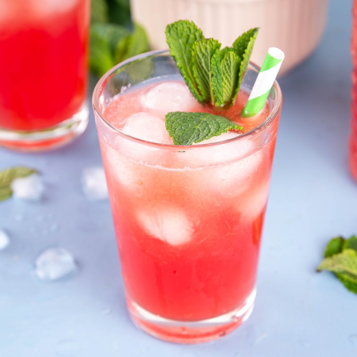 Sparkling watermelon fruit drink with ice and mint for refreshing café and specialty beverage menus